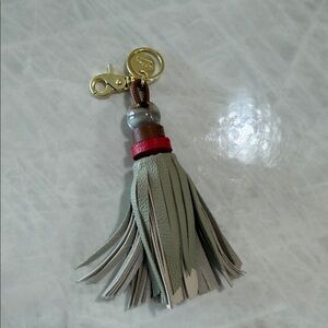 See By Chloe Gray and Red Tassel Keychain